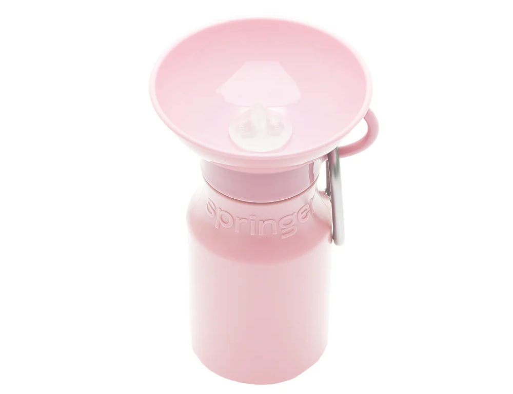 Springer Mini Travel Bottle in Cotton Candy, a light pink 15 oz dog water bottle with a fold-out bowl
