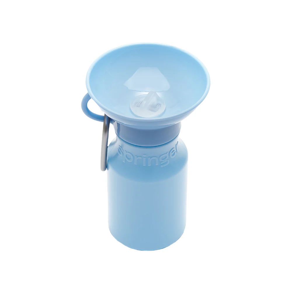 Springer Mini Travel Bottle in Sky Blue, a 15 oz dog water bottle with a fold-out bowl and carabiner