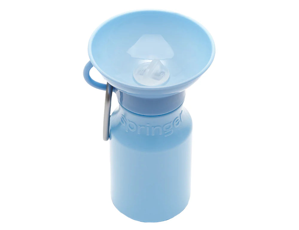 Springer Mini Travel Bottle in Sky Blue, a 15 oz dog water bottle with a fold-out bowl and carabiner