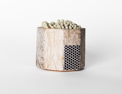 Tenn Prairie Concrete Match Holder in Grey & Gold with gray-tipped matches and a side striker