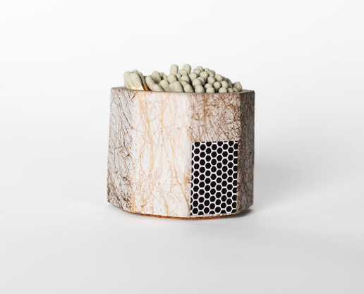 Tenn Prairie Concrete Match Holder in Grey & Gold with gray-tipped matches and a side striker