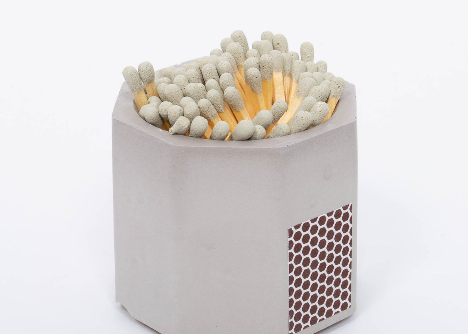 Tenn Prairie Concrete Match Holder in Grey with gray-tipped matches and a side striker