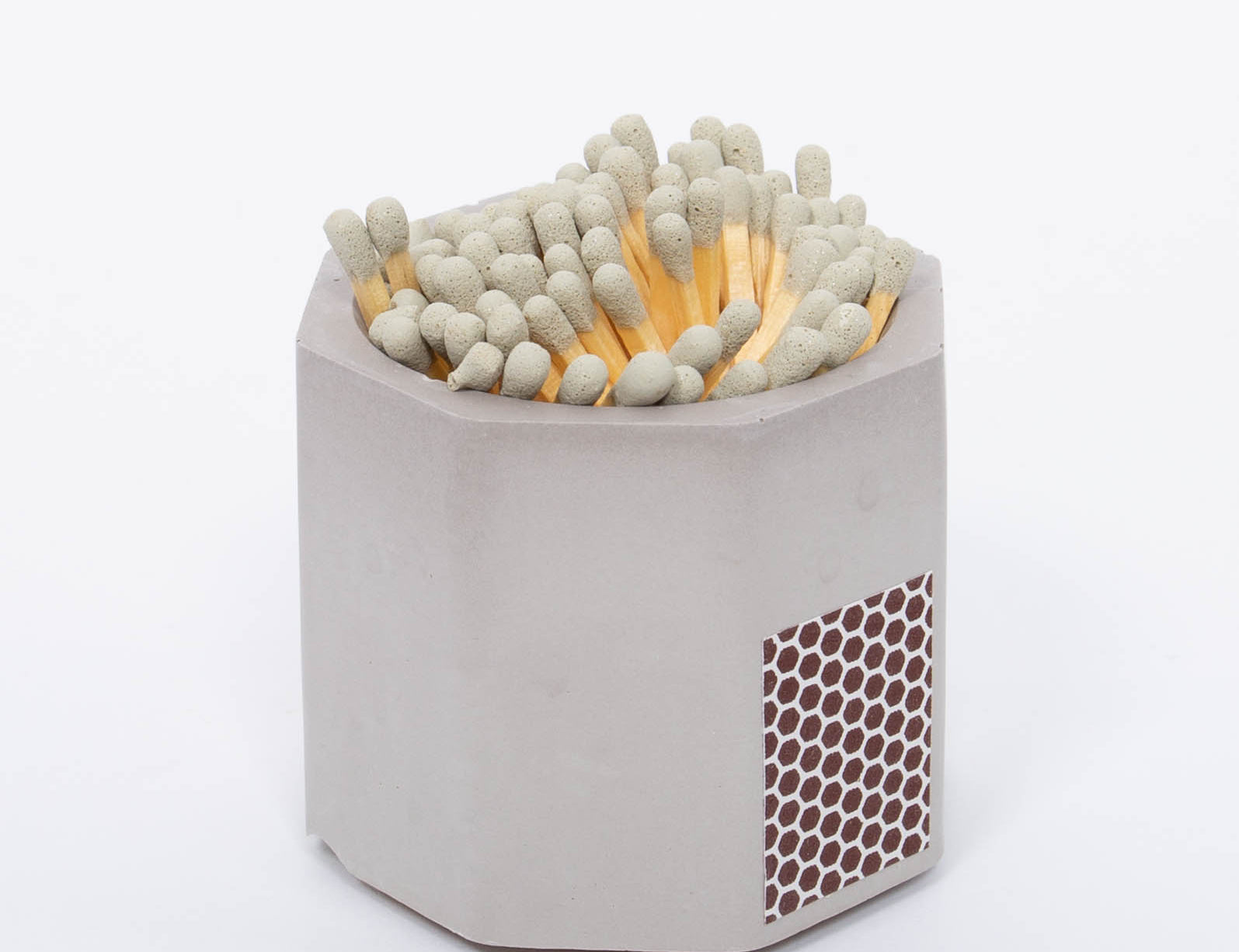 Tenn Prairie Concrete Match Holder in Grey with gray-tipped matches and a side striker