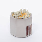 Tenn Prairie Concrete Match Holder in Grey with gray-tipped matches and a side striker