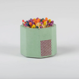 Tenn Prairie Concrete Match Holder in Matcha green with rainbow-tipped matches and a side striker