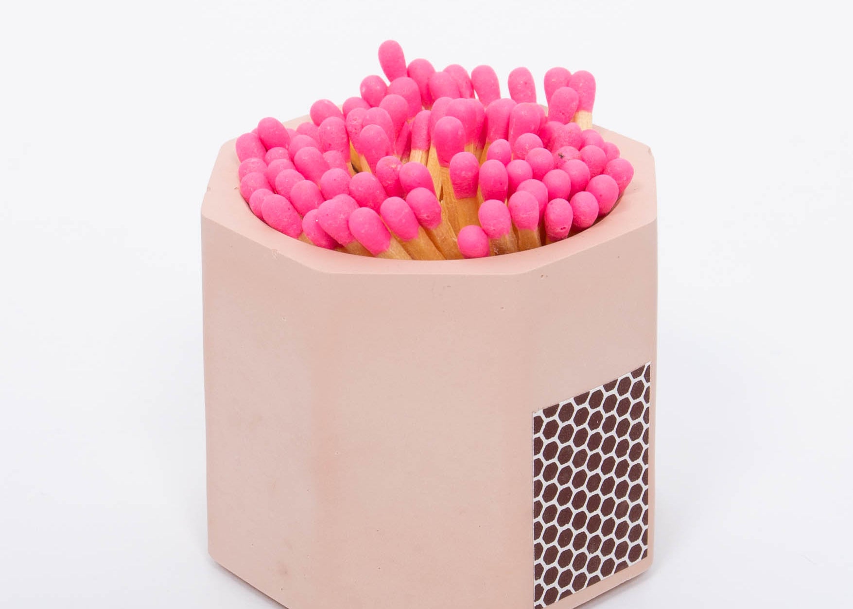 Tenn Prairie Concrete Match Holder in Pink with pink-tipped matches and a side striker
