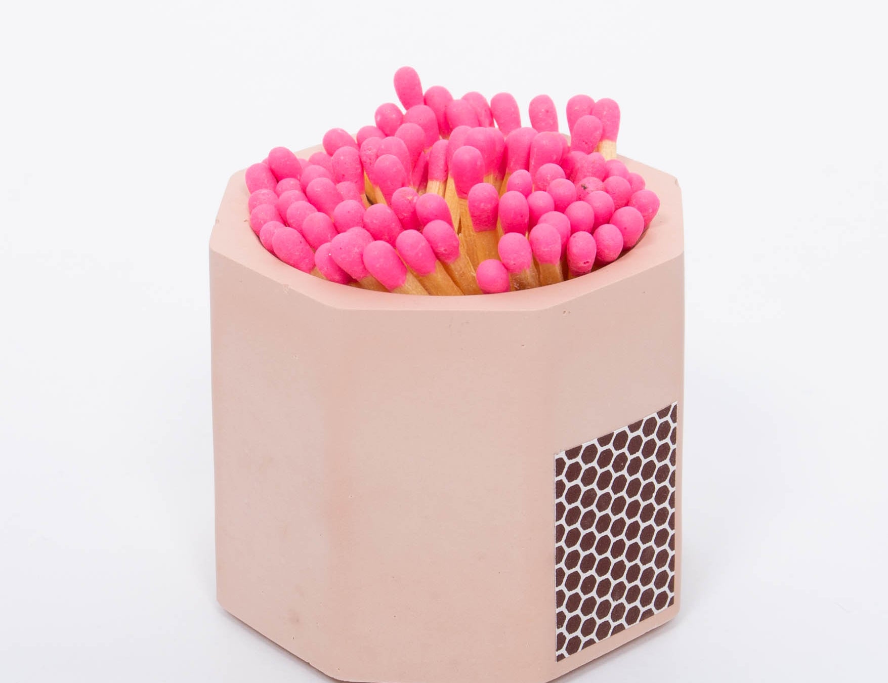 Tenn Prairie Concrete Match Holder in Pink with pink-tipped matches and a side striker
