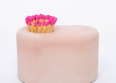 Tenn Prairie Streamliner Match Holder in Blush, a rounded pink concrete holder with pink-tipped matches