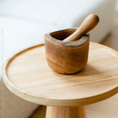 Texxture Takara Teak Root Mortar & Pestle on a round wooden stool