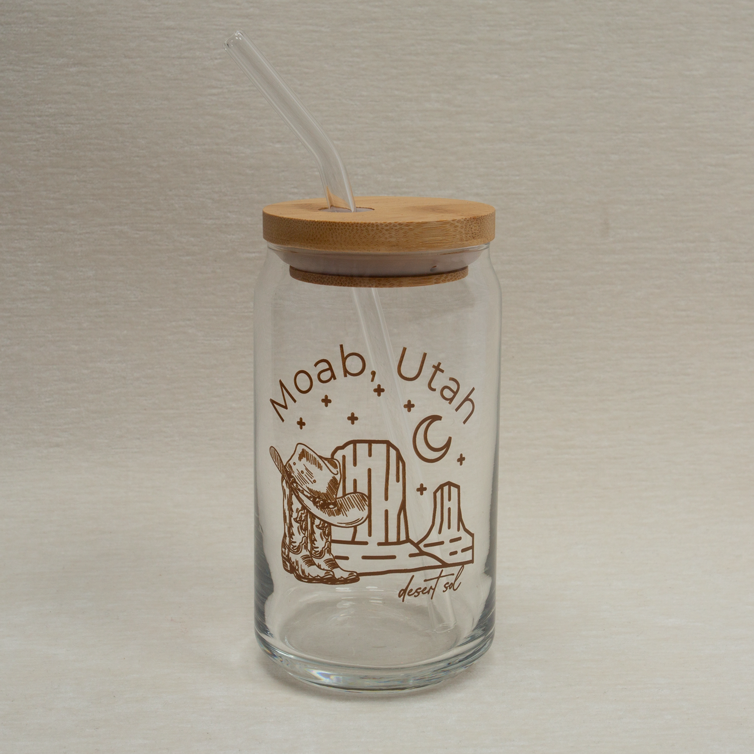 The Care Co Moab Desert Glass Can with bamboo lid and straw, front view of the Moab, Utah print