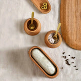 The Collective Belfort Oak Mortar and Marble Pestle from above with wooden salt cellars and spoons