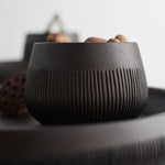 Close-up of the ribbed texture on The Collective Chiseled Leila Bowl in matte black