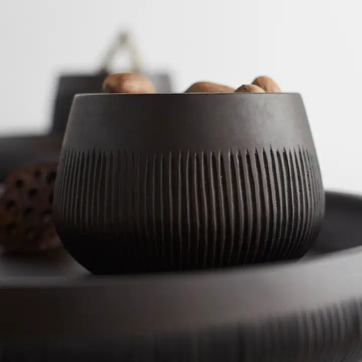 Close-up of the ribbed texture on The Collective Chiseled Leila Bowl in matte black
