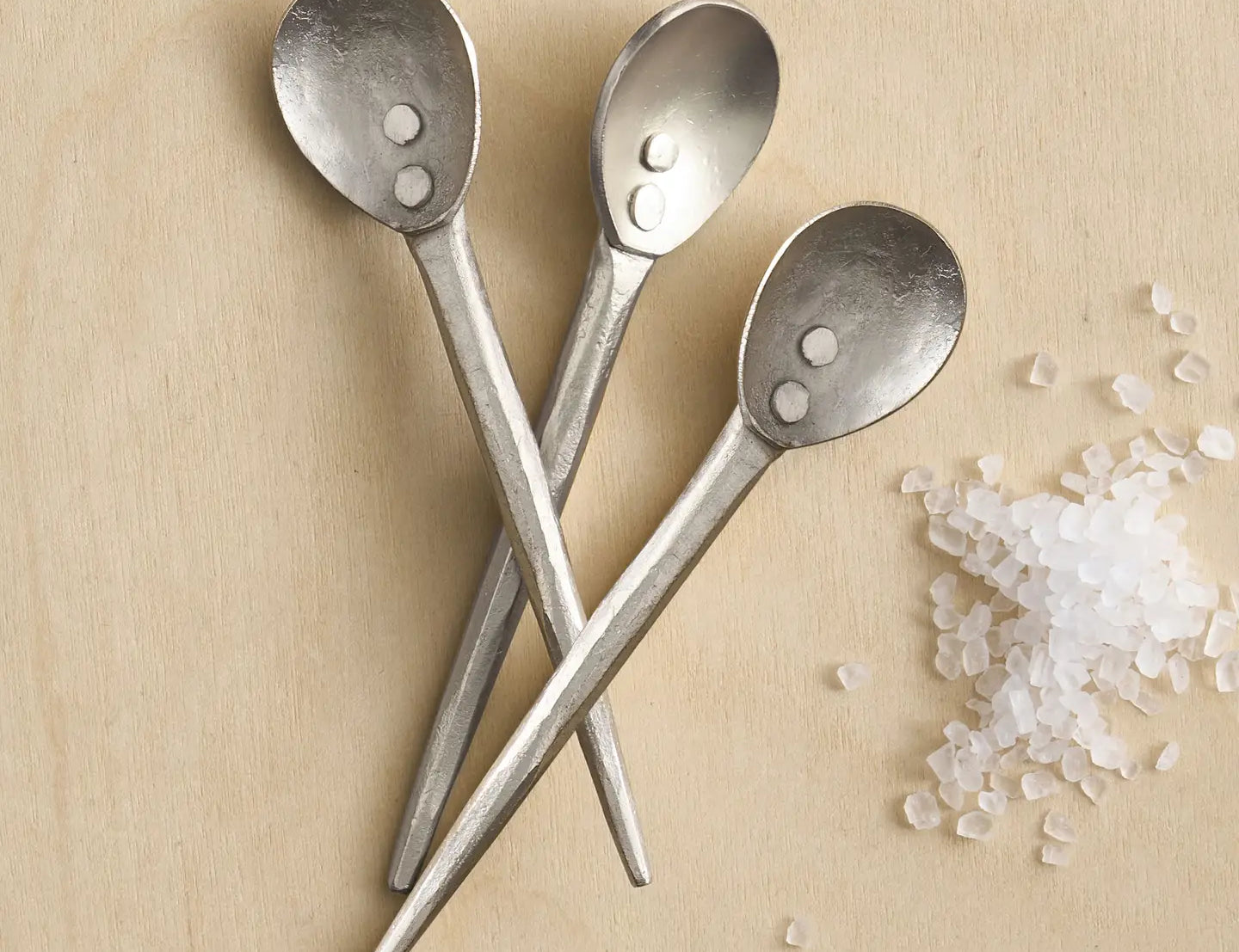 The Collective Forge Mini Spoons in Pewter, three hammered silver-tone spoons with coarse salt