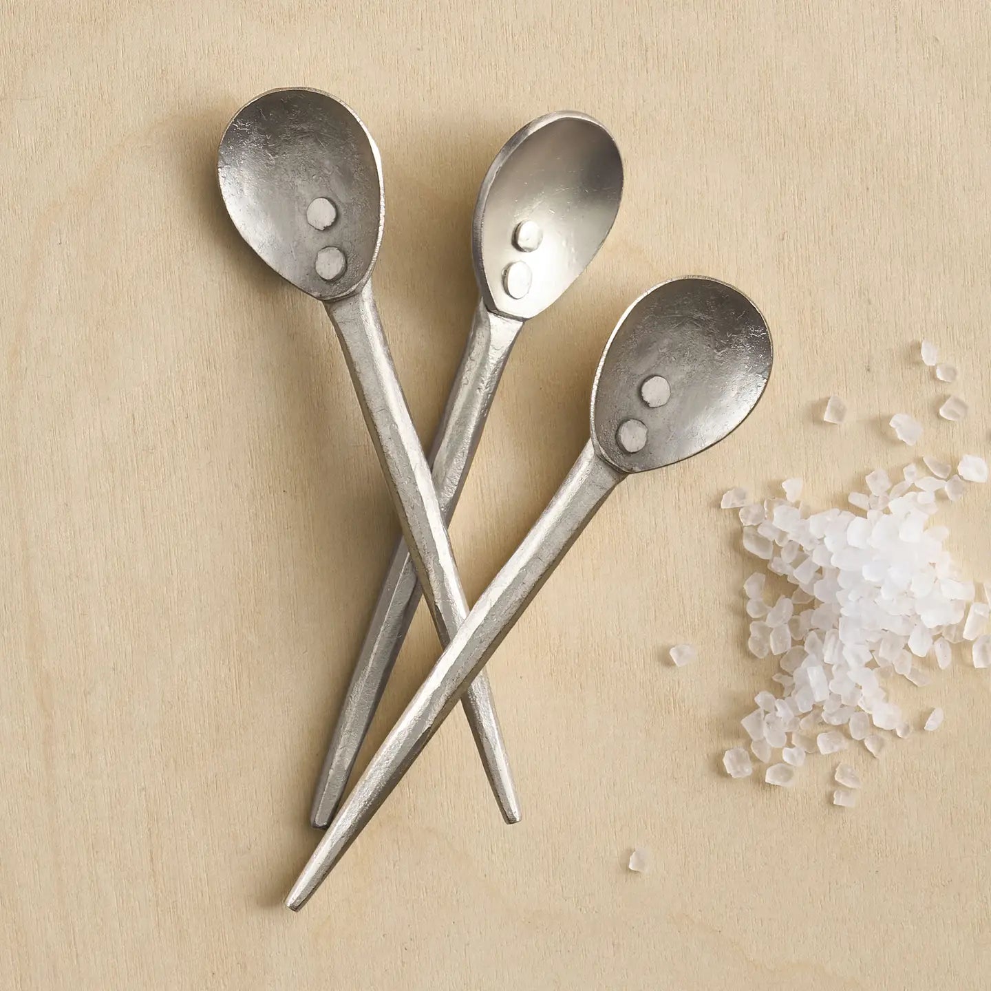 The Collective Forge Mini Spoons in Pewter, three hammered silver-tone spoons with coarse salt