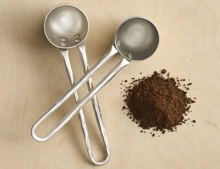The Collective Forge Pewter Coffee Scoops Set of 2, hammered silver scoops with ground coffee