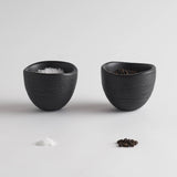 The Collective Groove Tidbit Bowls Set of 2, two small matte black textured bowls with salt and pepper