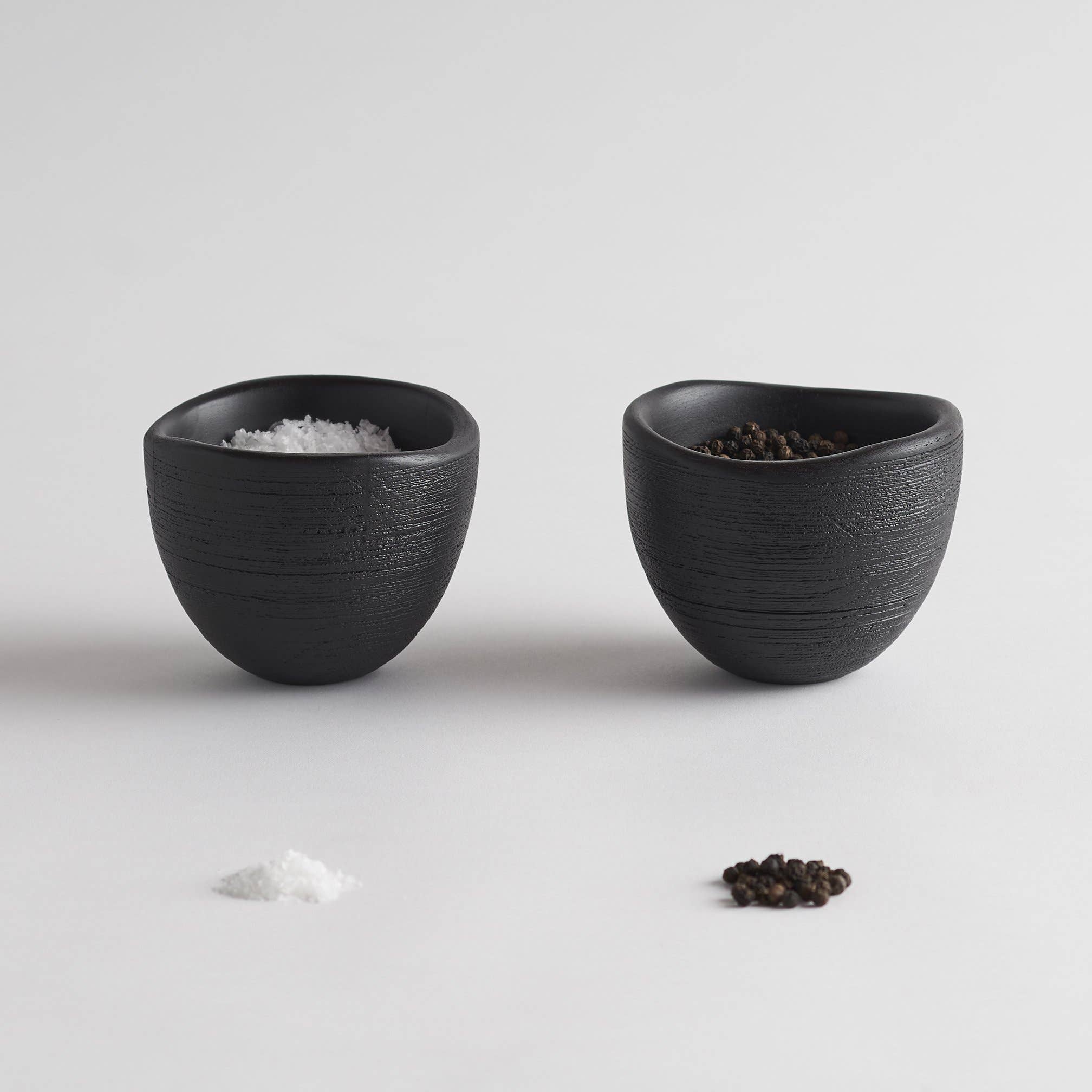 The Collective Groove Tidbit Bowls Set of 2, two small matte black textured bowls with salt and pepper