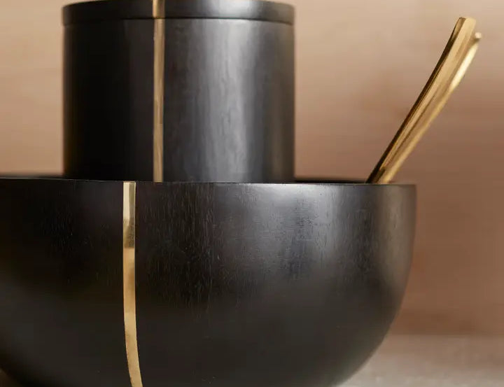 The Collective Mondrian Serving Bowl stacked with a matching black lidded canister