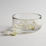 The Collective Pebbled Salad Bowl, a wide textured glass bowl with white flower petals