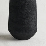 Close-up of the rough black pumice texture on The Collective Pumice Vase