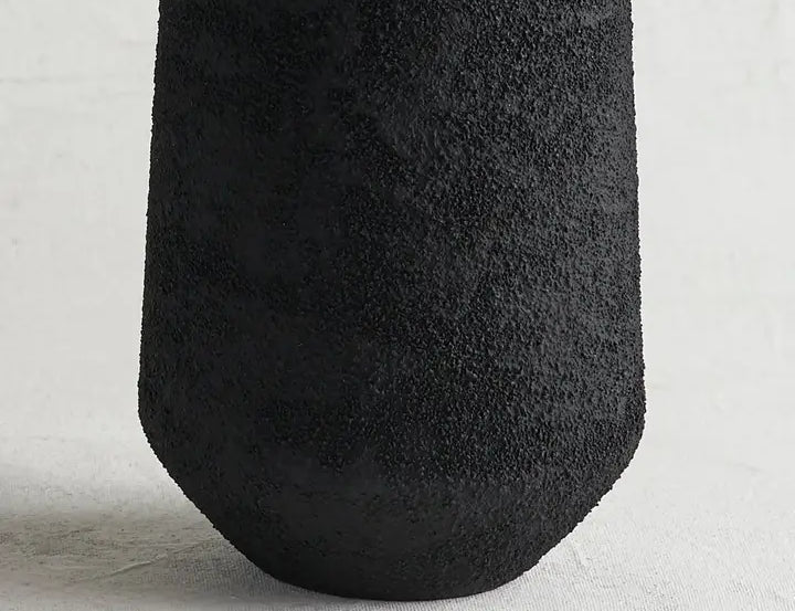Close-up of the rough black pumice texture on The Collective Pumice Vase