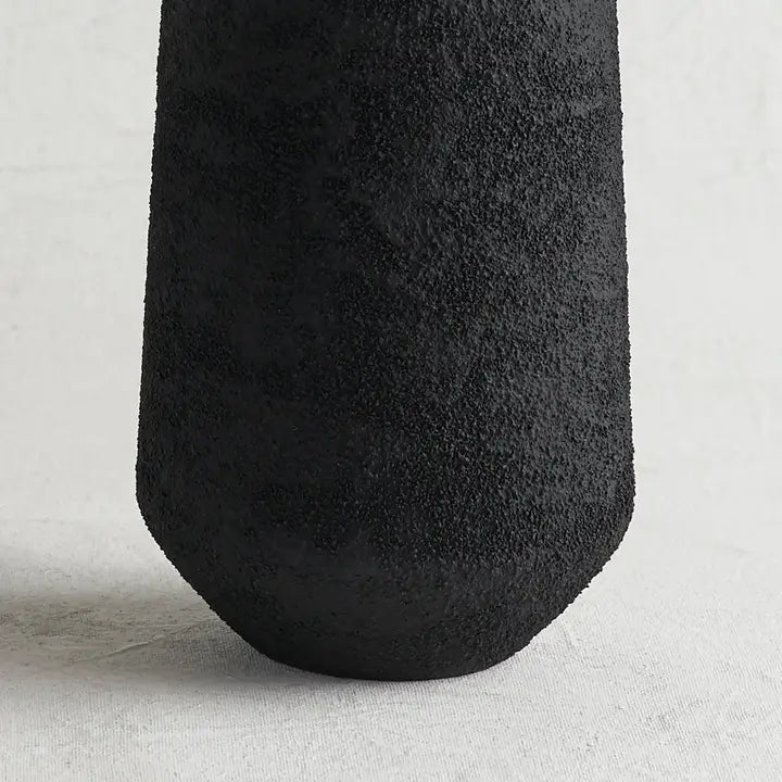 Close-up of the rough black pumice texture on The Collective Pumice Vase