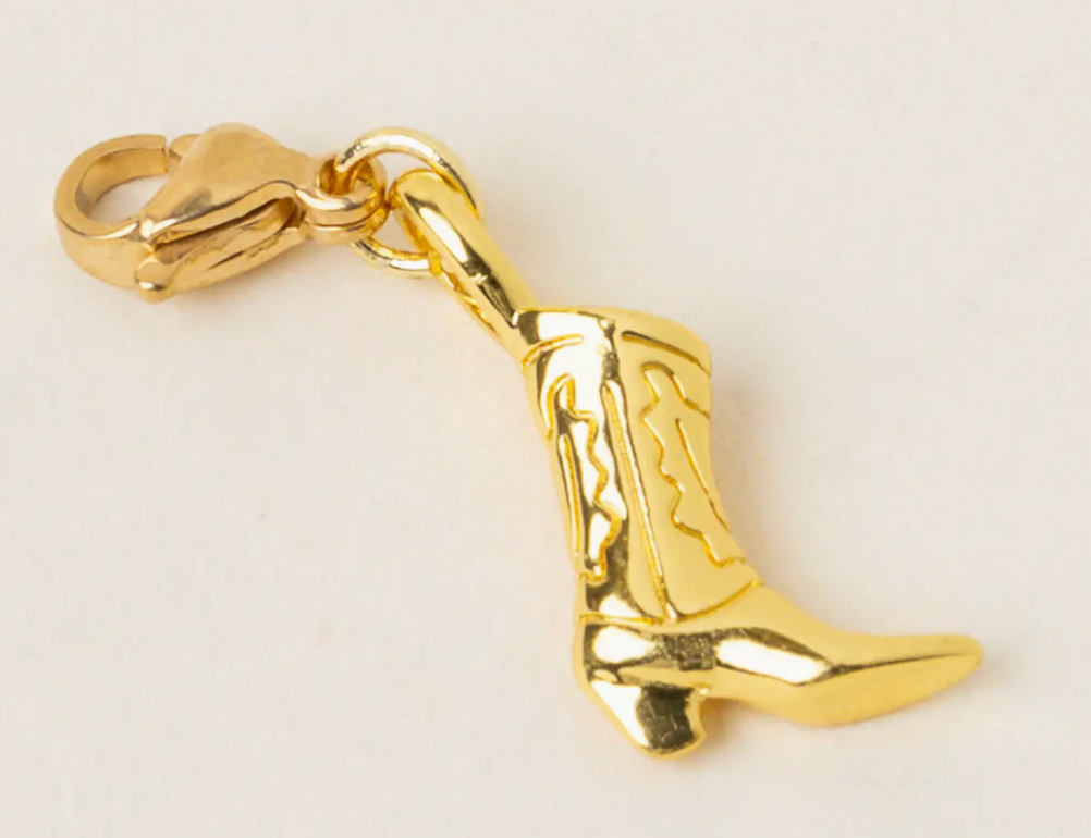 The Darling Effect Jewelry Charm, a gold cowboy boot charm on a lobster clasp