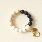 The Darling Effect Hands-Free Keychain Wristlet in Keep it Classy, cream, black and white silicone beads with a gold clasp