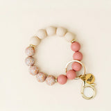 The Darling Effect Hands-Free Keychain Wristlet in Mauve Muse, blush, floral and rose silicone beads with a gold clasp
