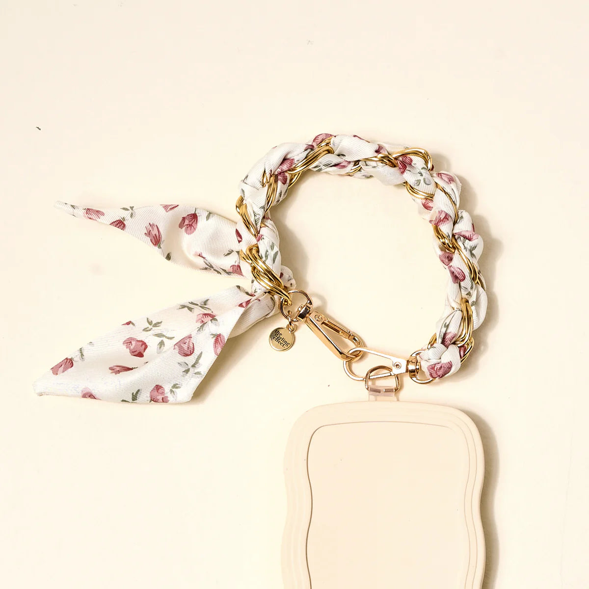 The Darling Effect Phone Scarf in Garden Party attached to a cream phone case