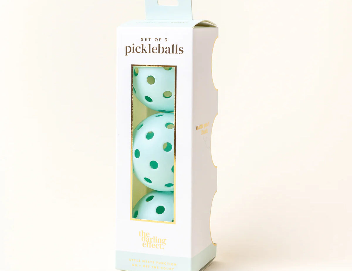 The Darling Effect Pickleball Ball Set in Aqua, a box of three aqua pickleballs