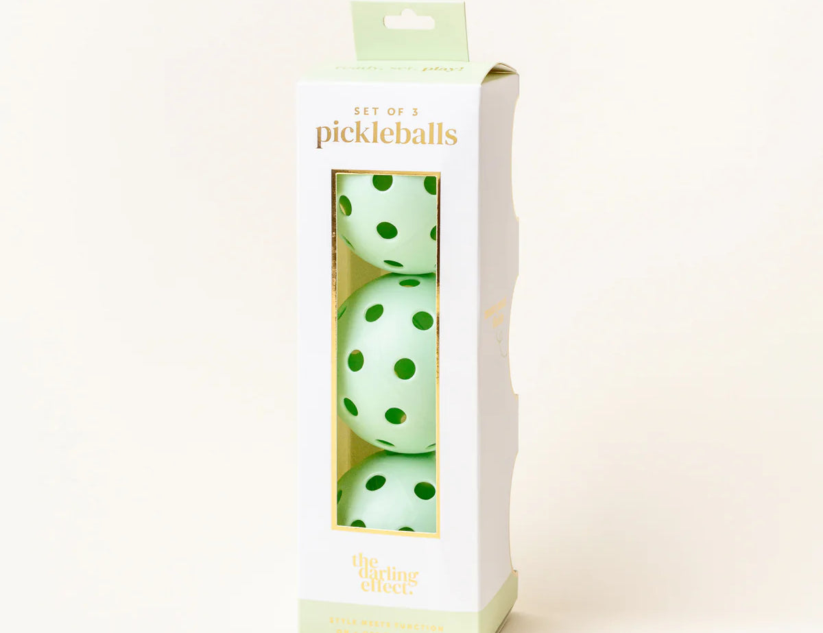 The Darling Effect Pickleball Ball Set in Green, a box of three mint green pickleballs