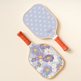 The Darling Effect Pickleball Paddle in Bouquet Beauty Purple, a lavender daisy paddle with a purple floral case
