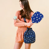 Woman holding The Darling Effect Pickleball Paddle in Endless Daydream with its navy floral case