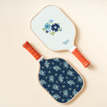 The Darling Effect Pickleball Paddle in Endless Daydream, a blue floral paddle with a navy floral case