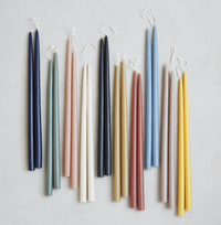 The Floral Society 12-inch Taper Candles, pairs of hand-dipped tapers in navy, sage, cream, terracotta, blush, mustard and grey hanging by their wicks