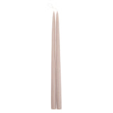 The Floral Society 18-inch Dipped Taper Candles in Greige, a pair of soft taupe-grey tapers hanging by their wick on white