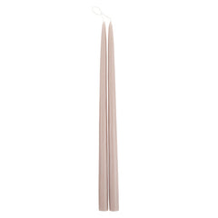 The Floral Society 18-inch Dipped Taper Candles in Greige, a pair of soft taupe-grey tapers hanging by their wick on white