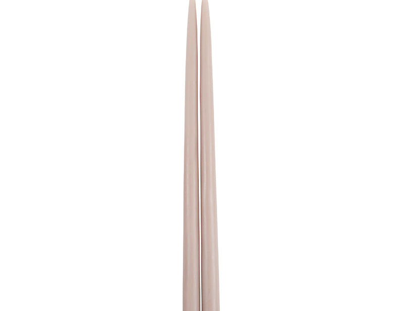 The Floral Society 18-inch Dipped Taper Candles in Greige, a pair of soft taupe-grey tapers hanging by their wick on white