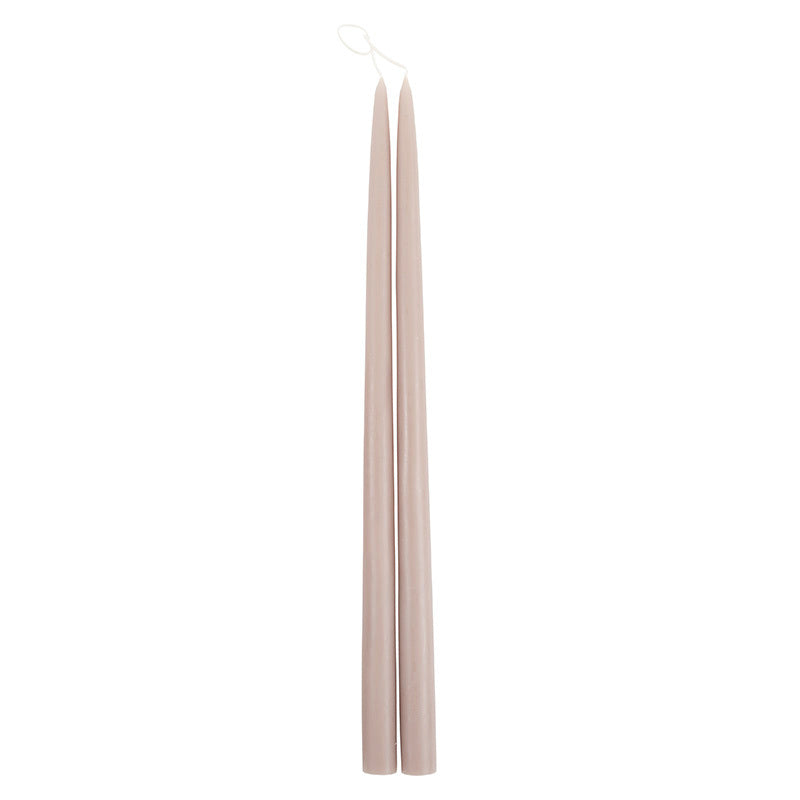 The Floral Society 18-inch Dipped Taper Candles in Greige, a pair of soft taupe-grey tapers hanging by their wick on white