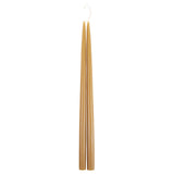 The Floral Society 18-inch Dipped Taper Candles in Miel, a pair of honey-gold tapers hanging by their wick on white