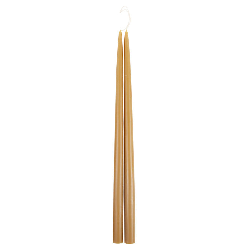 The Floral Society 18-inch Dipped Taper Candles in Miel, a pair of honey-gold tapers hanging by their wick on white