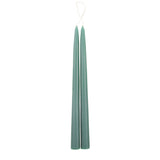 The Floral Society 18-inch Dipped Taper Candles in Moss green, a pair of sage-green tapers hanging by their wick on white
