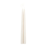 The Floral Society 18-inch Dipped Taper Candles in Parchment, a pair of ivory tapers hanging by their wick on white