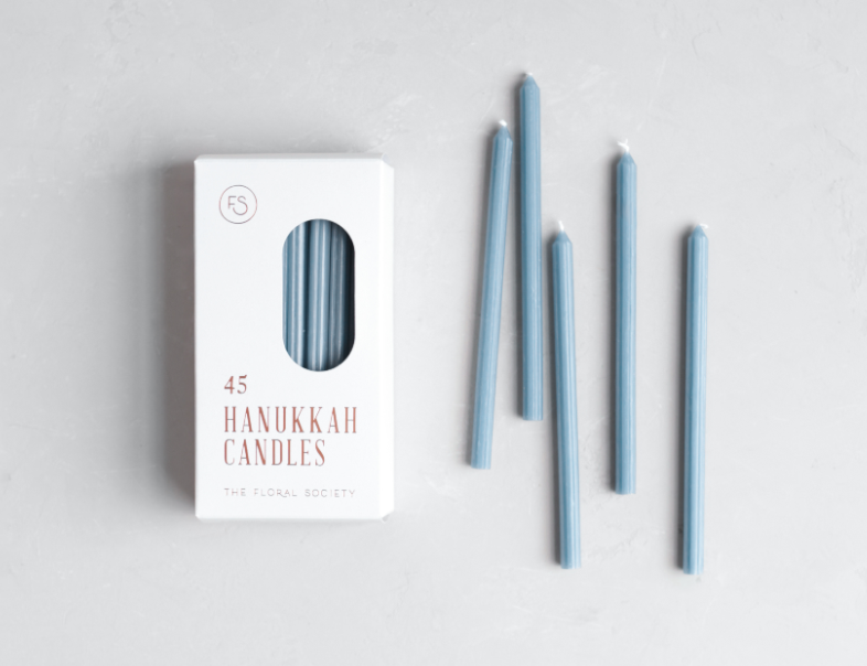 Hanukkah Candles, box of 45 slim ribbed candles in dusty blue with five candles laid beside it