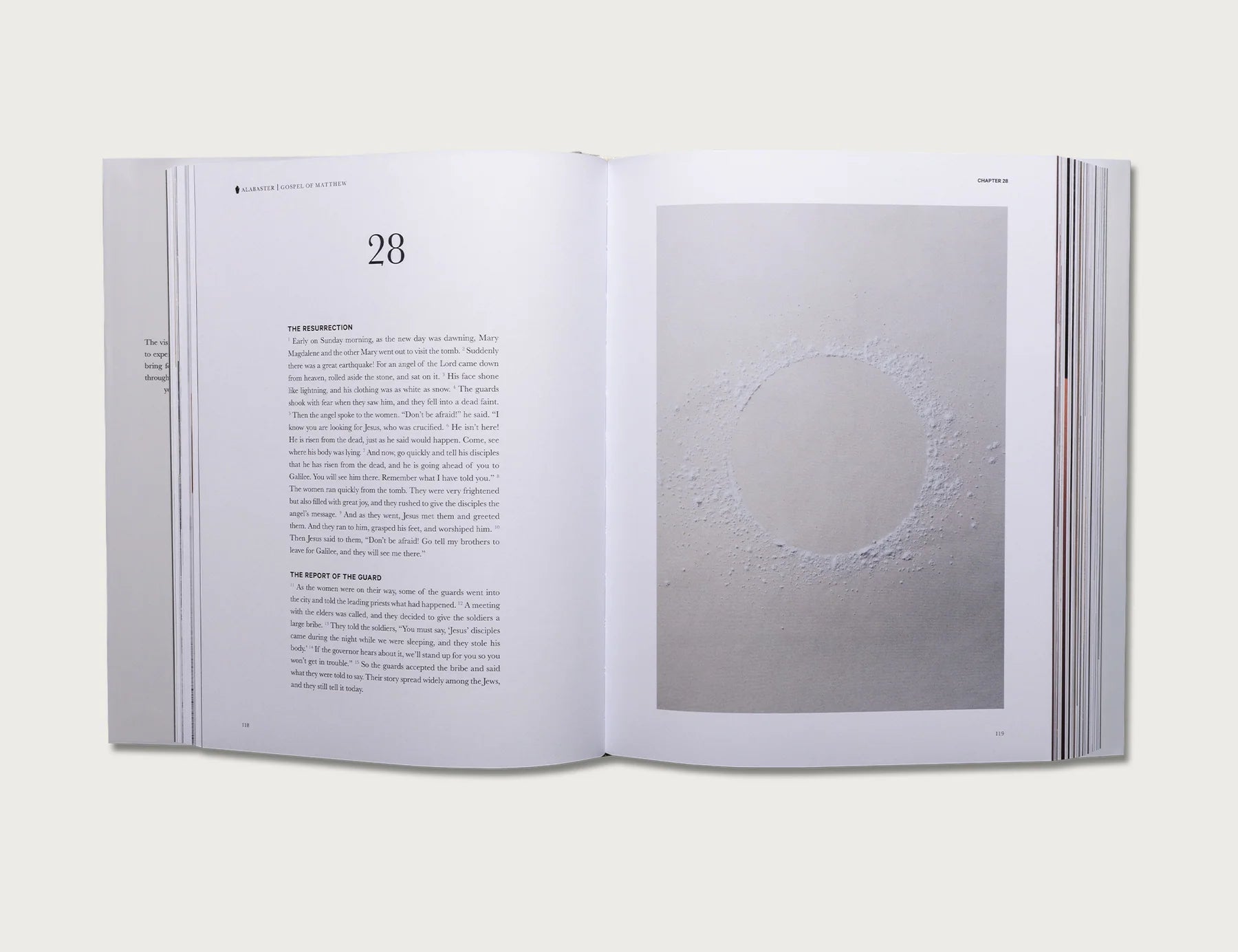 The Gospels book open to chapter 28 with a full-page photo