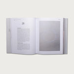 The Gospels book open to chapter 28 with a full-page photo