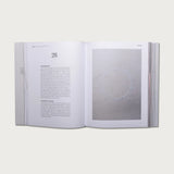 The Gospels book open to chapter 28 with a full-page photo