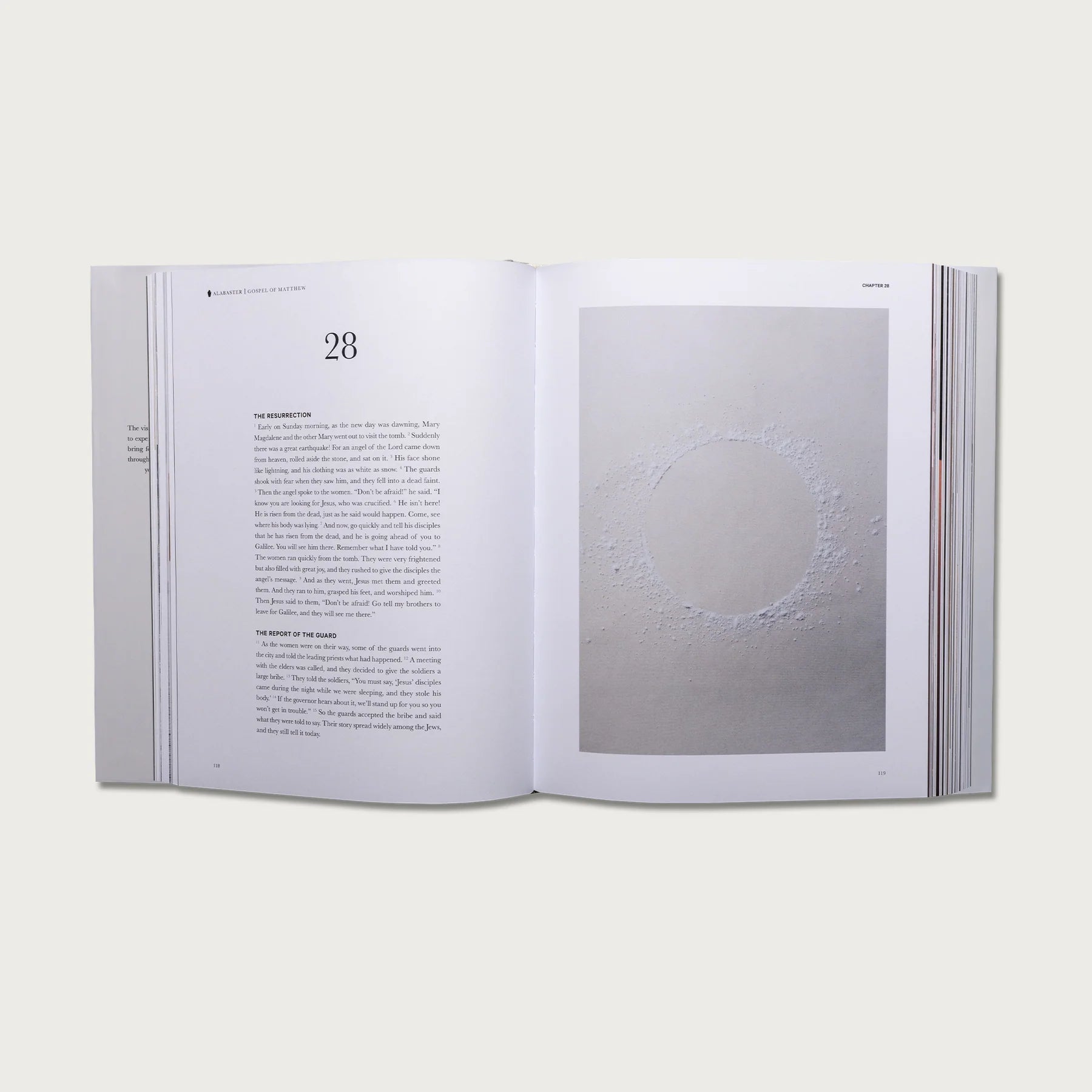 The Gospels book open to chapter 28 with a full-page photo